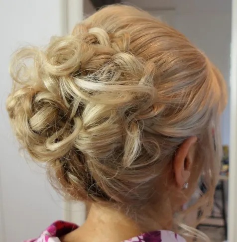 Large Bun with Messy Curls Mother of the Bride Hairstyles