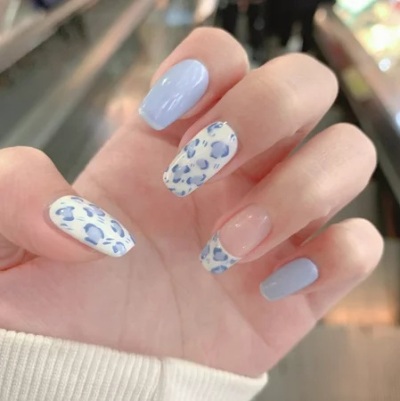 baby blue nail with delicate floral decals or stickers