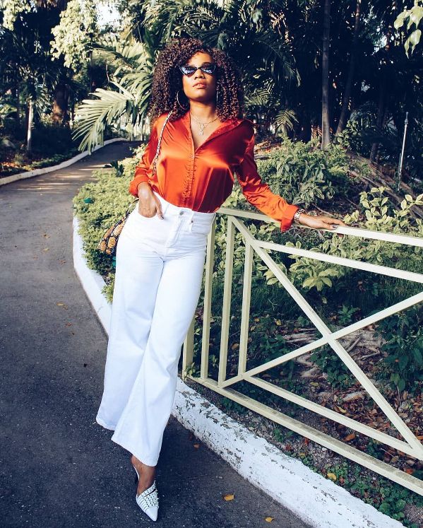 Orange blouse with white wide-leg pants and wedges