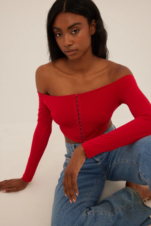 a red off-the-shoulder top with high-waisted jeans for a trendy and chic look For Casual Events