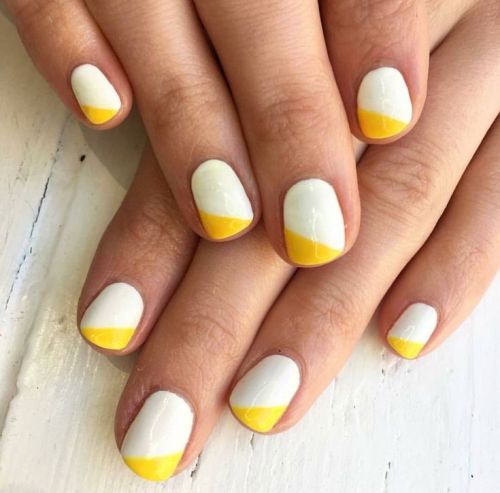yellow and white geometric nail design